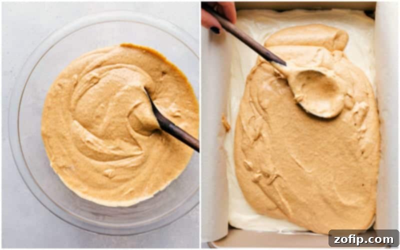 A baking pan filled with pumpkin cheesecake bars, recently baked with a golden streusel topping, ready for chilling and caramel.