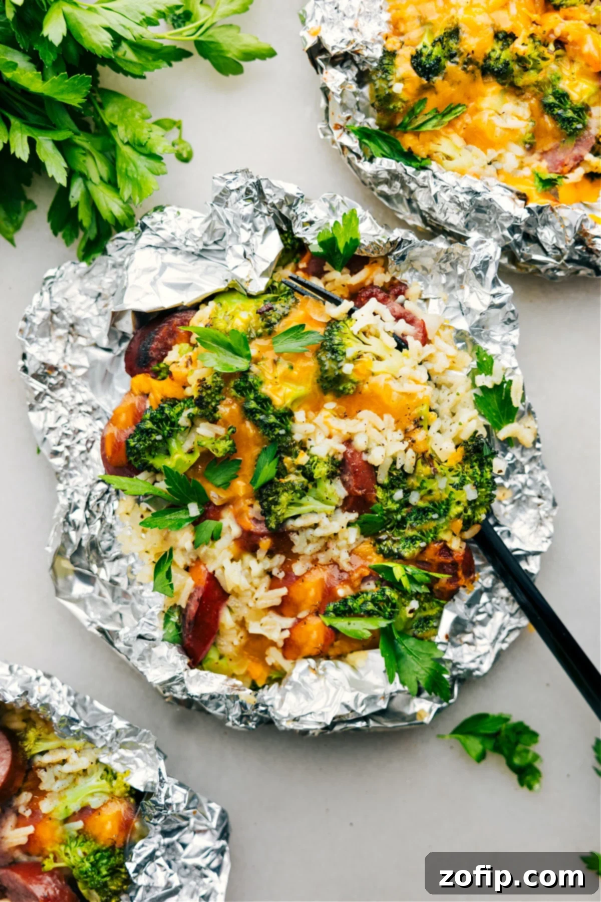 Delicious Foil Pack Cheesy Broccoli & Chicken, hot off the grill and ready to be served.