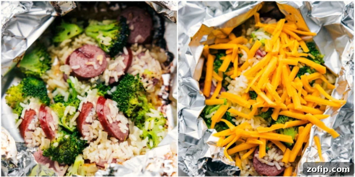 The delicious Cheesy Broccoli & Chicken dinner in a foil pack, freshly cooked, with shredded cheese being added on top.