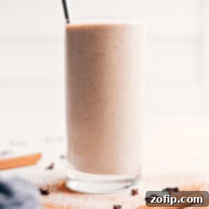 A close-up shot of the perfectly blended homemade chai smoothie, highlighting its inviting, creamy texture and rich, spiced color.