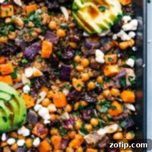 A vibrant close-up of the finished Sheet Pan Quinoa Pilaf, garnished with fresh parsley and avocado, ready to be served.