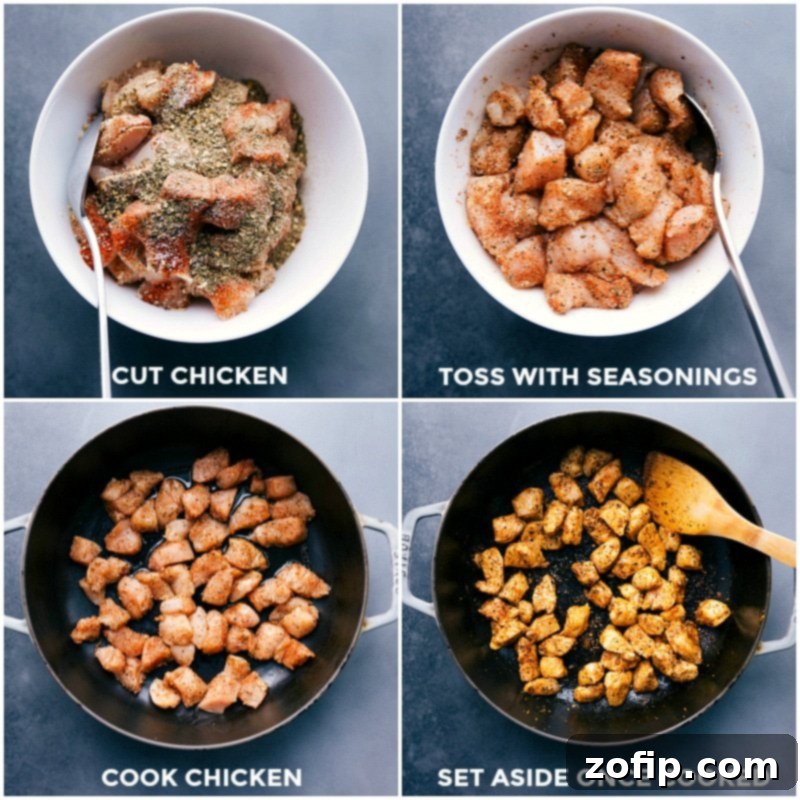 Bite-sized chicken pieces being seared in a hot skillet until golden brown.