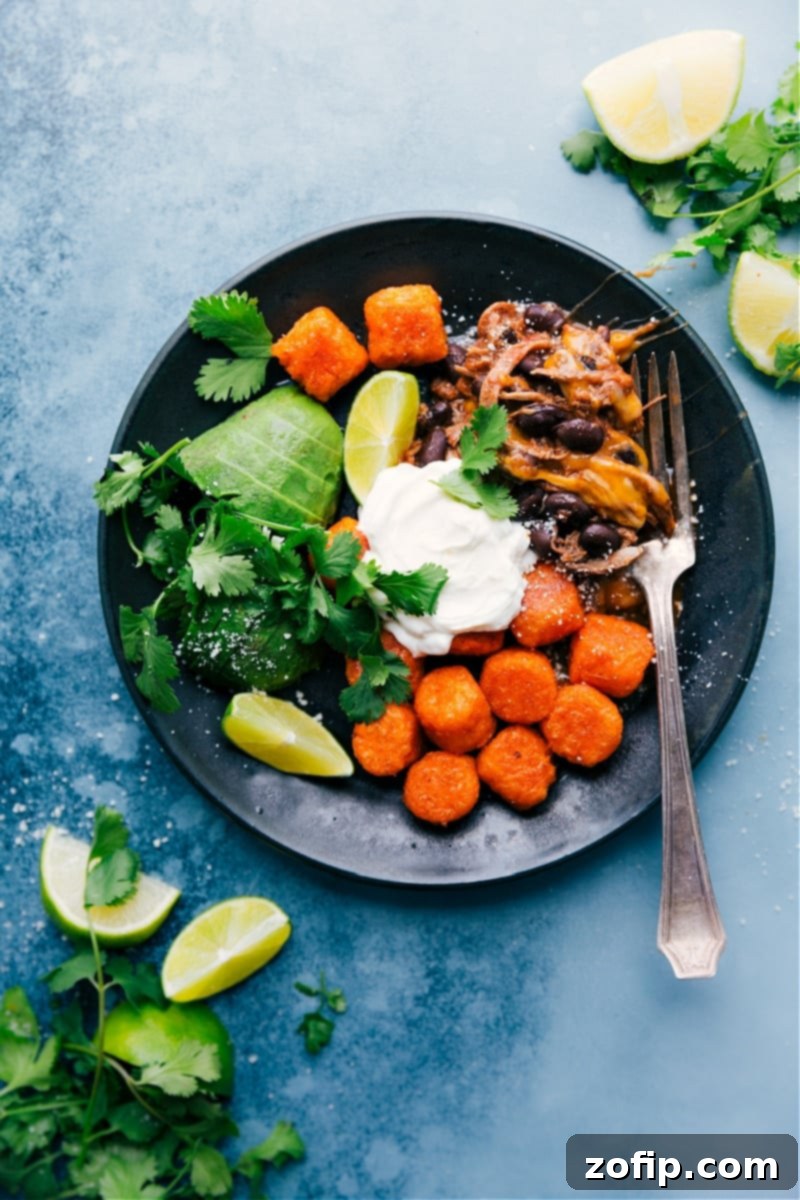 Deconstructed Beef Totchos with crispy sweet potato tots, savory beef, and fresh toppings