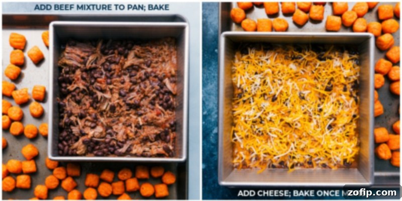 The beef mixture and sweet potato puffs baking on a sheet pan, with cheese added on top of the beef
