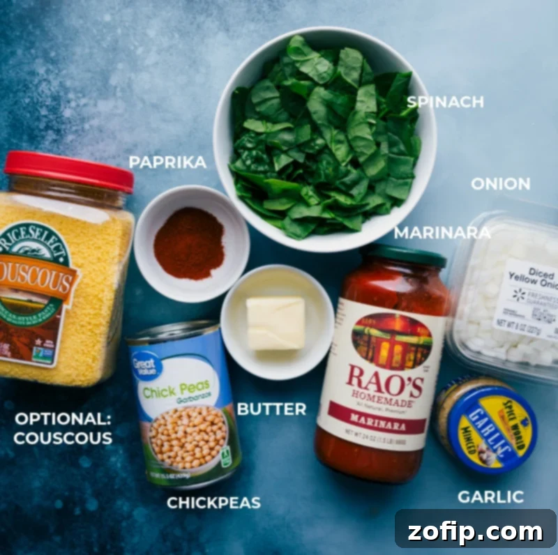 The essential components for our delightful Beans On Toast: garbanzo beans, fresh baby spinach, unsalted butter, savory paprika, diced onion, minced garlic, and a quality marinara sauce. Key ingredients laid out for Beans on Toast recipe: chickpeas, spinach, butter, paprika, onion, garlic, marinara.