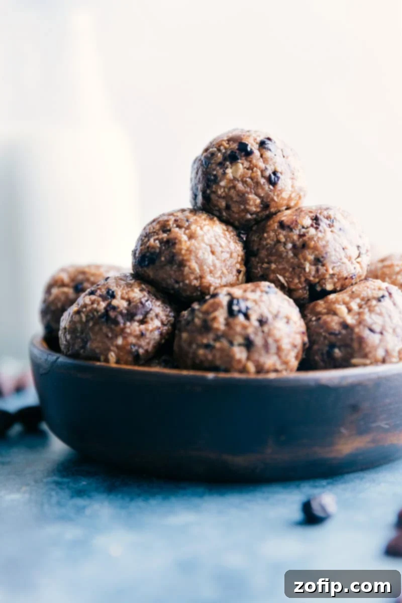 A Bowl Full of Healthy Goodness: Freshly Prepared Blueberry Energy Bites. A close-up shot of freshly made Blueberry Energy Bites artfully arranged in a rustic wooden bowl.