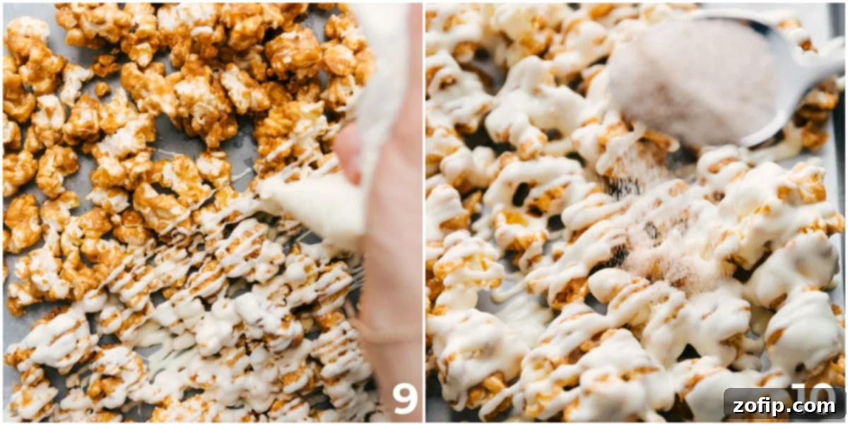 Close-up view of freshly made Cinnamon Roll Popcorn, generously drizzled with luscious white chocolate and beautifully sprinkled with a sweet cinnamon sugar blend, highlighting the decadent and irresistible coating.