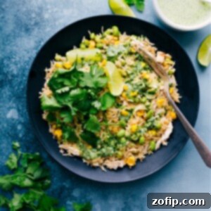 Close-up of Coconut Chicken and Rice, showcasing its textures and vibrant sauce.