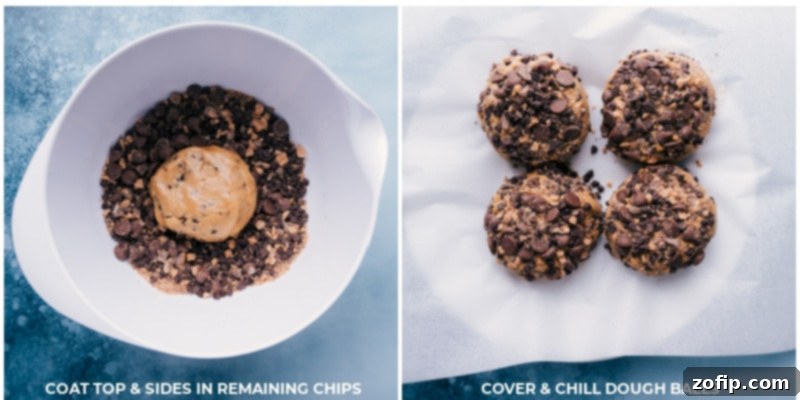 Process shot of cookie dough balls being generously rolled and coated in the remaining chocolate chips for an overloaded finish.