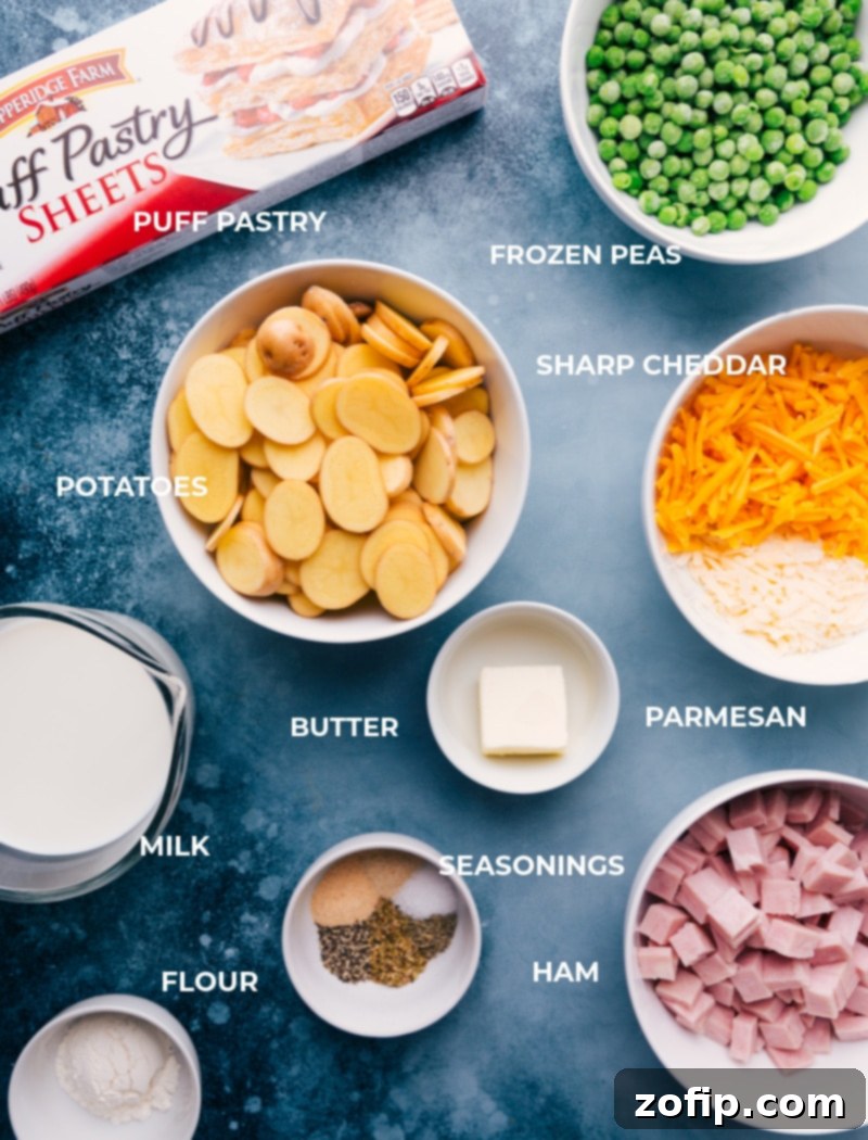 Key Ingredients for Ham And Potato Pot Pie A curated selection of fresh ingredients neatly prepped and ready for assembly, including thinly sliced potatoes, blocks of sharp cheddar and parmesan cheese, a bowl of cubed ham, sweet green peas, seasonings, butter, milk, and flour, all set for making a savory ham and potato pot pie.