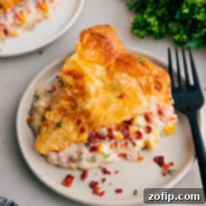 A perfectly baked Corn Chowder Pot Pie, golden brown and bubbly, presented in a pie dish.
