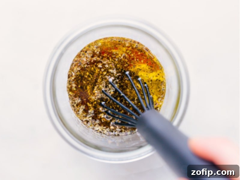 Process shots illustrating the final step of making Italian dressing, showing the ingredients being vigorously whisked together in a bowl.