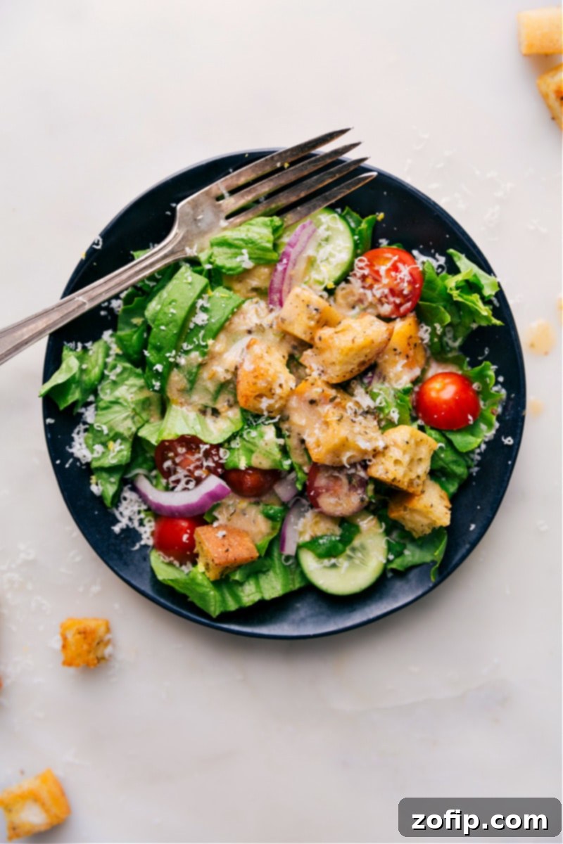 Overhead image of a beautifully presented salad, perfectly topped with homemade Italian Dressing, highlighting its appetizing appeal.