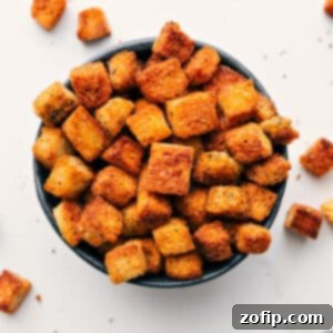 Transform Bread into Delicious Croutons 3 Close-up of golden brown homemade croutons in a small white bowl.