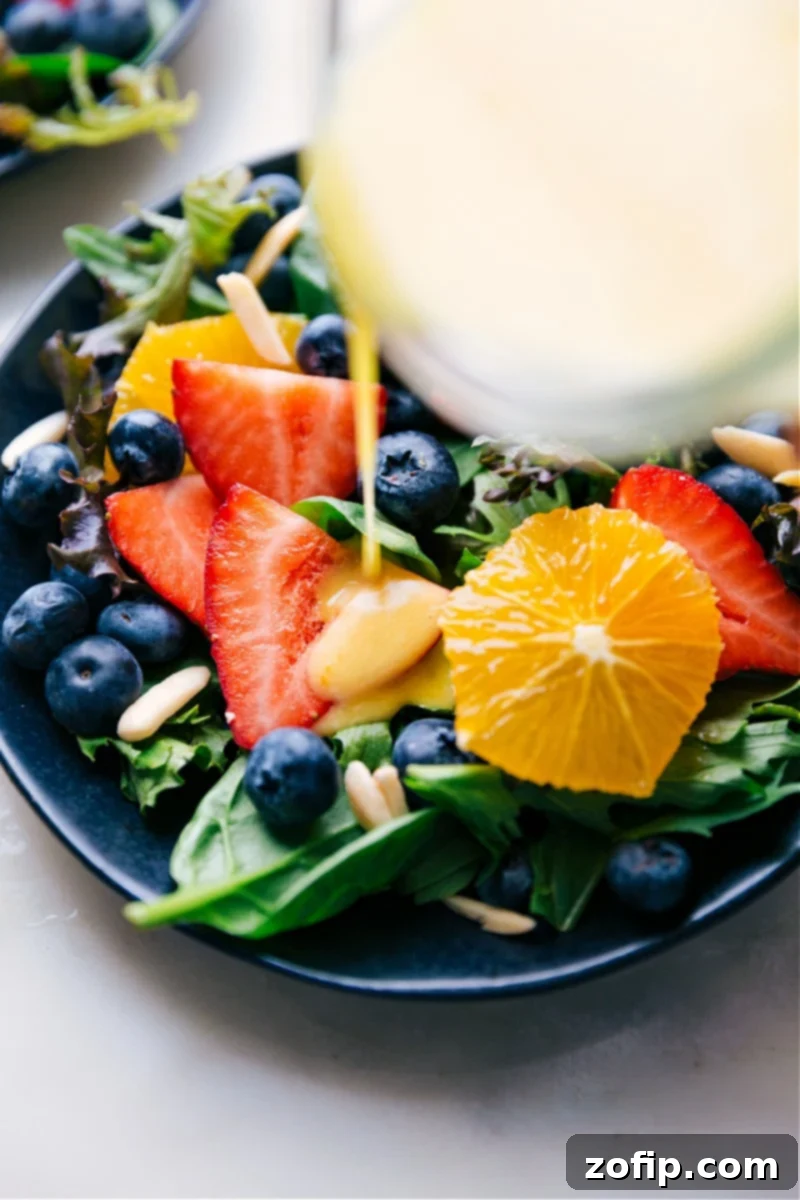Delicious Citrus Vinaigrette Pouring Over Fresh Greens Image of the Citrus Vinaigrette being poured over a salad