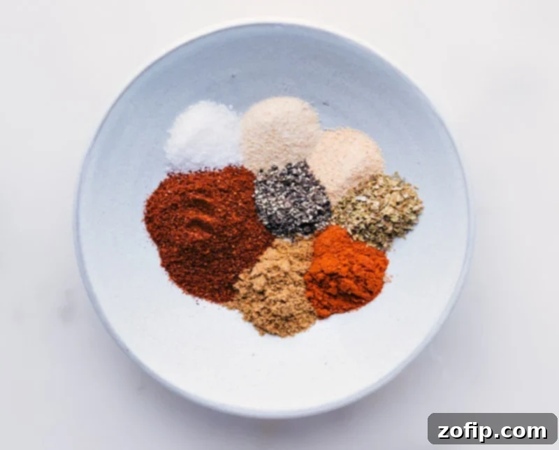 Process shots showing individual taco seasoning spices compartmentalized in a bowl before mixing.