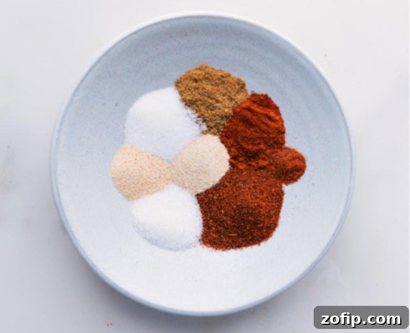 Overhead image of all the spices added to a bowl, ready to be mixed
