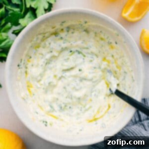 Refreshing Tzatziki Sauce 2 A bowl of creamy homemade Tzatziki Sauce, garnished with fresh herbs, ready for serving.