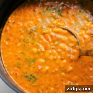 A vibrant, close-up image of a bowl of creamy White Bean Soup, garnished with fresh thyme and a drizzle of olive oil, ready to be served.