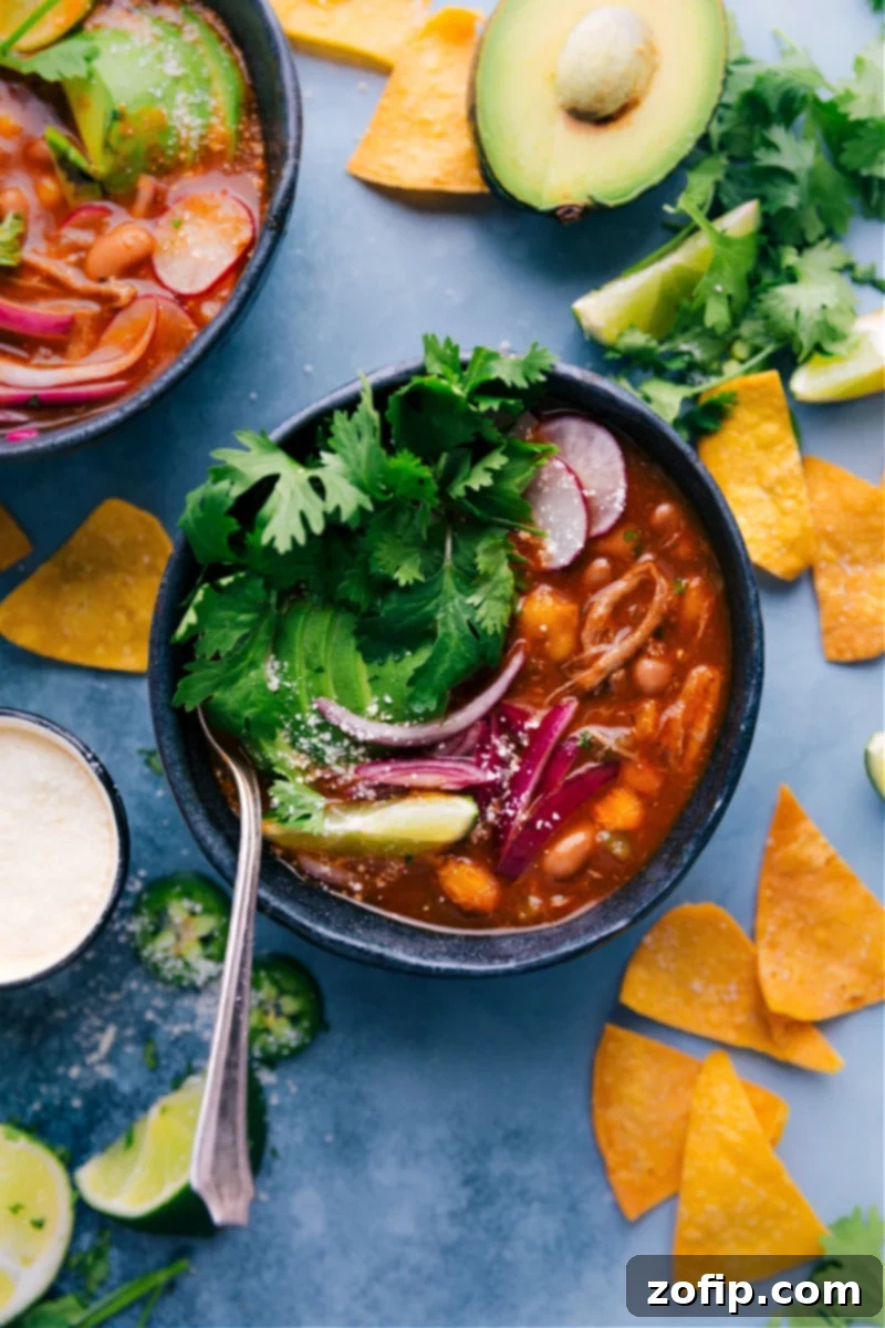 A hearty bowl of Mexican-inspired Pozole with hominy, pulled pork, and fresh toppings, ready in 30 minutes.