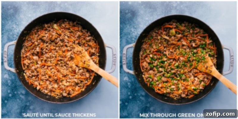Stir-fry sauce simmering until thickened and glossy, with green onions added in
