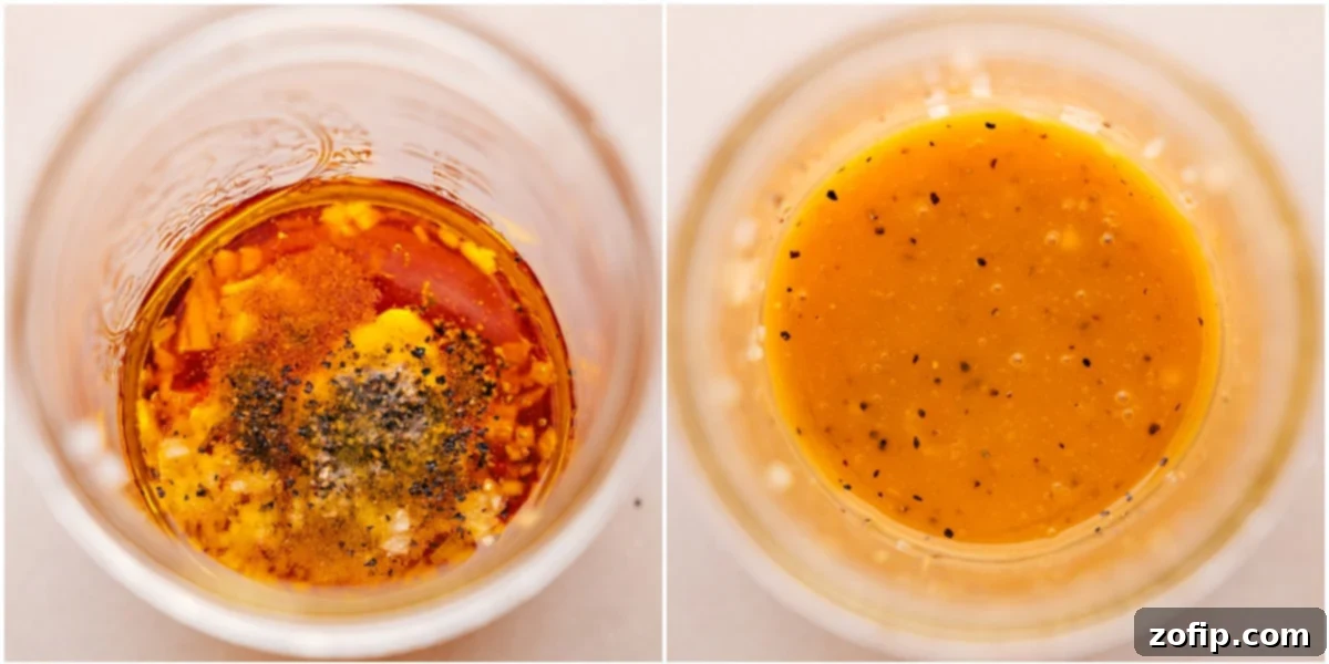 The homemade honey-Dijon salad dressing being shaken in a wide-mouth mason jar to perfectly emulsify the ingredients.