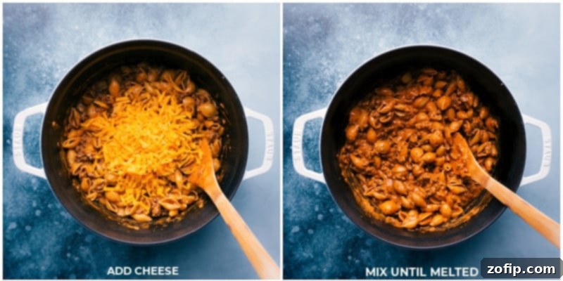 Melting sharp cheddar cheese into creamy beef and shells Process shots of Creamy Beef and Shells: Adding the cheese and mixing it all together