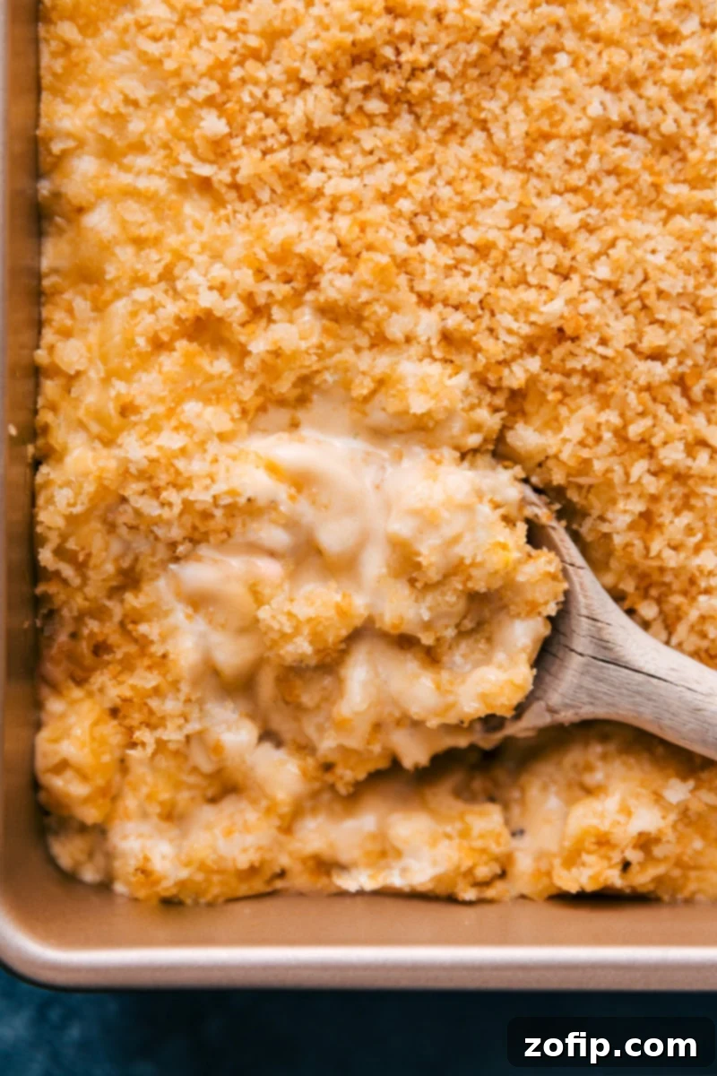 An overhead view of a deliciously baked mac and cheese, showcasing its golden crispy topping and creamy interior.