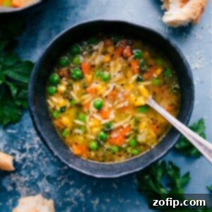 Hearty Veggie Noodle Bowl 3 A vibrant bowl of one-pot vegetable noodle soup with orzo pasta, ready to serve.