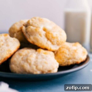 Rustic Cloud Biscuits 2 Close-up of freshly baked golden drop biscuits on a cooling rack.