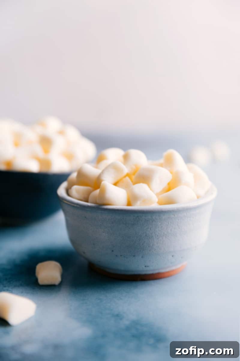 A beautifully arranged bowl of soft, pastel-colored homemade Butter Mints, ready to be enjoyed.