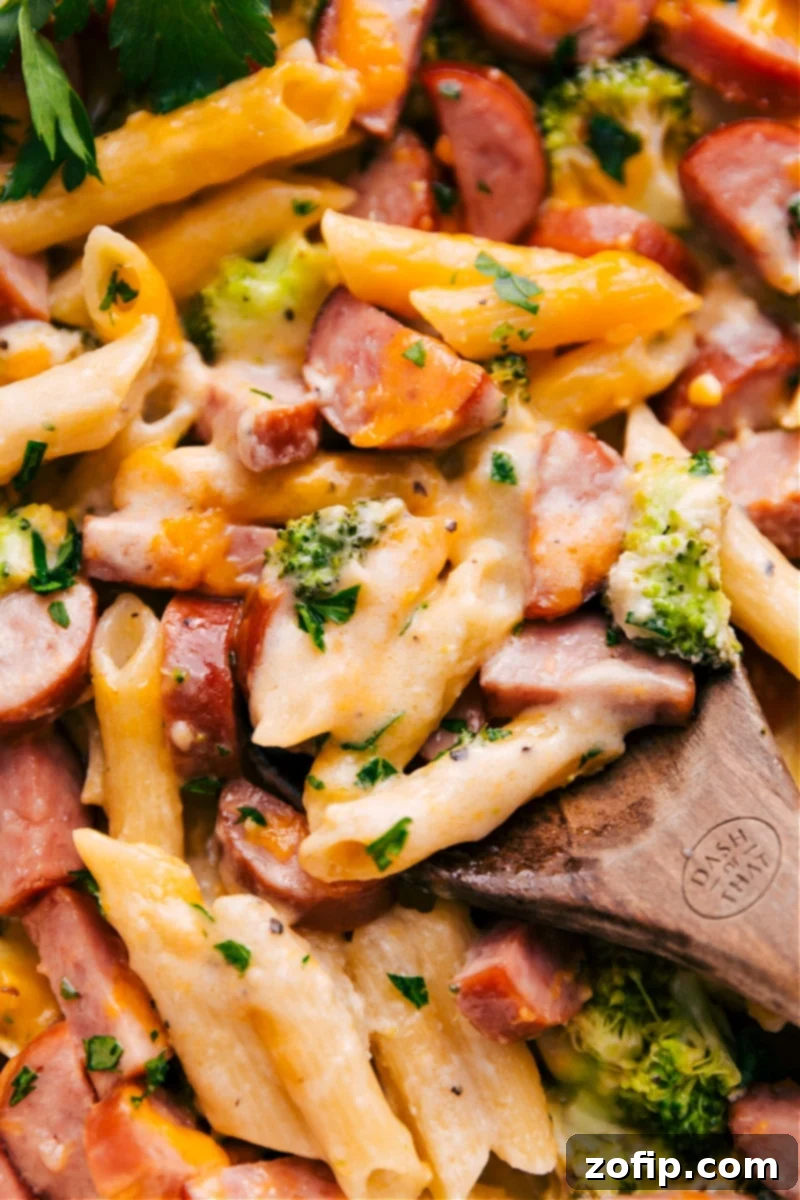 Overhead image of the Cheesy Sausage Pasta fresh out of the oven, garnished with fresh parsley.