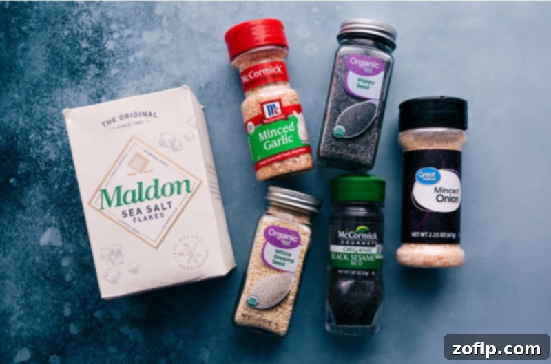 Close-up image of the individual ingredients for Everything Bagel Seasoning laid out before mixing.