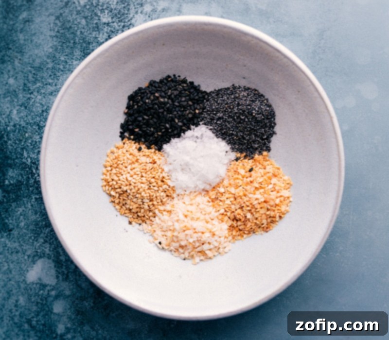 Overhead shot of all the Everything Bagel Seasoning ingredients expertly combined in a single bowl, ready for storage or use.