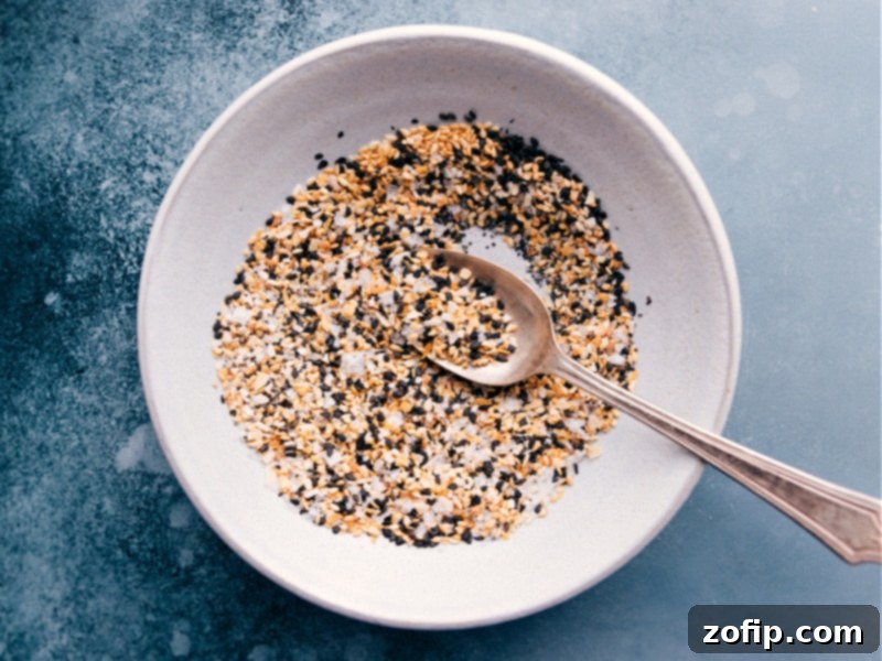 Close-up shot of Everything Bagel Seasoning sprinkled over a finished dish, ready to be served.