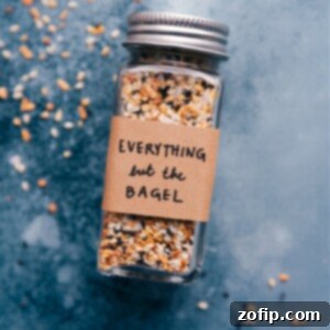 Everything Bagel Seasoning in a small bowl with a spoon.