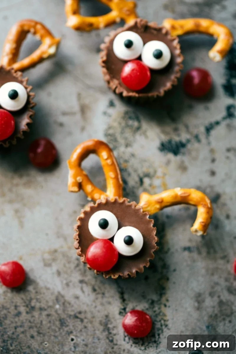 Close-up of adorable 5-ingredient mini reindeer treats made with Reese's Cups, pretzels, and M&Ms