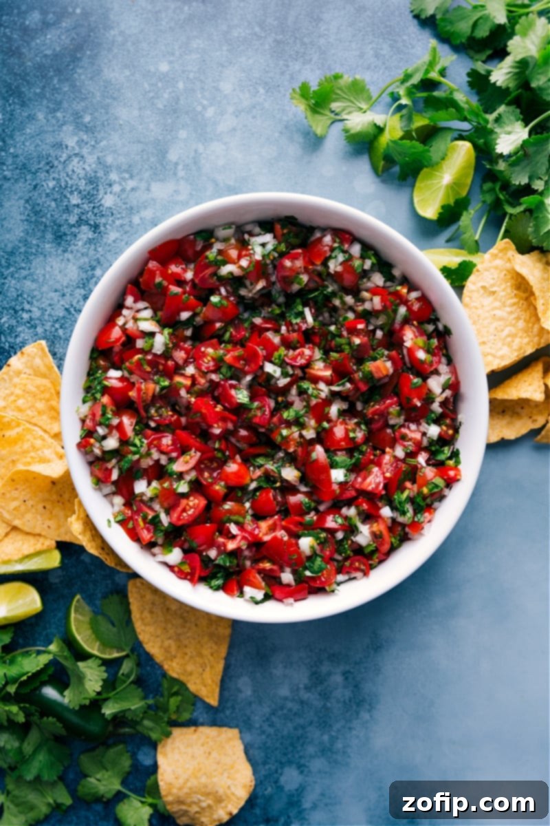 Overhead image of freshly prepared Pico De Gallo, a vibrant red and green chunky salsa