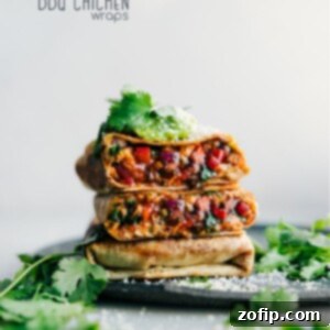 Zesty BBQ Chicken Roll-ups 10 A perfectly arranged BBQ Chicken Wrap, sliced in half to show the juicy chicken, melted cheese, and fresh veggies inside.