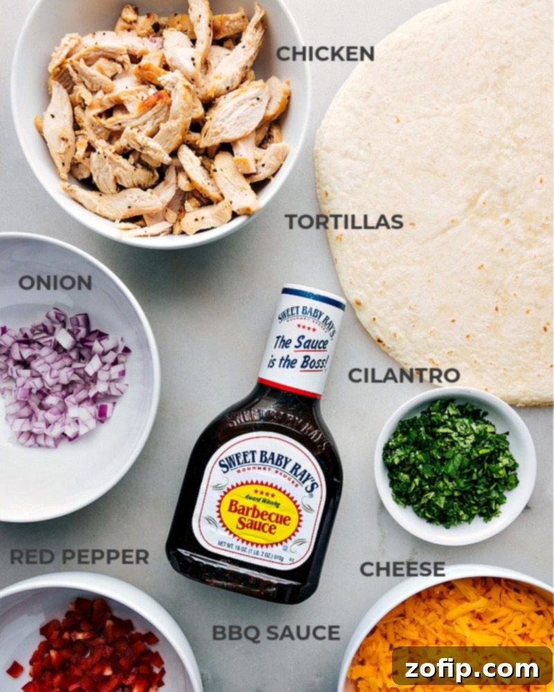 Zesty BBQ Chicken Roll-ups 4 A vibrant flat lay image showcasing all the fresh ingredients for BBQ Chicken Wraps: shredded chicken, BBQ sauce, cilantro, red onion, red bell pepper, shredded sharp cheddar cheese, tortillas, salt, and pepper.