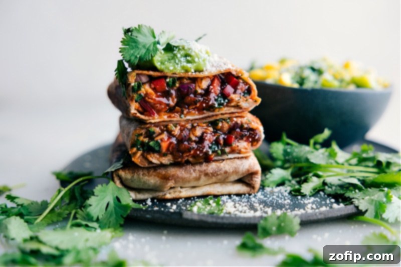 Zesty BBQ Chicken Roll-ups 9 Beautifully arranged BBQ Chicken Wraps, showcasing the golden-brown tortillas and the inviting filling.