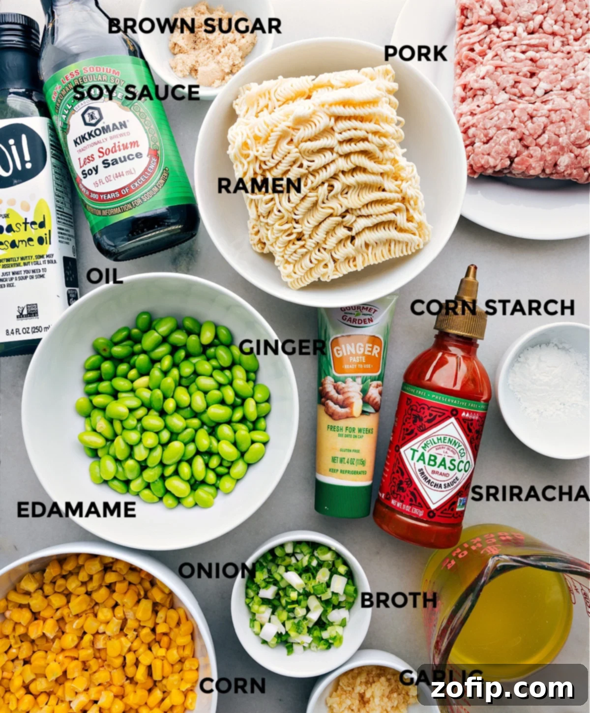 Ingredients In Pork Ramen Stir Fry Recipe All the fresh and frozen ingredients including brown sugar, ground pork, ramen noodles, fresh ginger, cornstarch, shelled edamame, green onion, chicken broth, frozen corn, and minced garlic, all perfectly prepped out for easy assembly of the Pork Ramen Stir Fry.