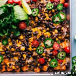 A serving of Totchos with all the toppings, showcasing the crispy tater tots, melted cheese, and fresh garnishes.