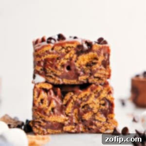 A plate of golden brown S'mores Cereal Bars, showcasing their gooey texture.