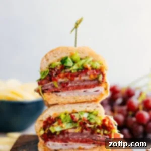 Italian Hoagies stacked on top of each other ready to enjoy.