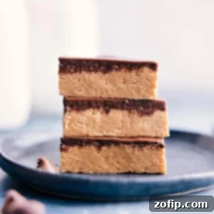 Close-up of a stack of no-bake peanut butter bars, highlighting the texture and layers.