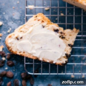 A freshly baked Irish Soda Bread with a golden crust and a perfect 'X' score on top.