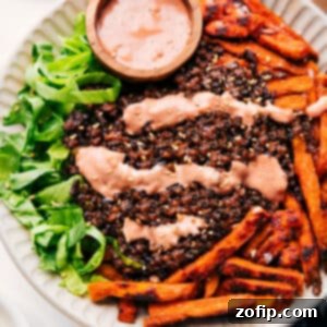 Ultimate Bunless Burger Bowl 3 A beautifully assembled Burger Bowl with crispy sweet potato fries, seasoned ground beef, fresh toppings, and creamy burger sauce.