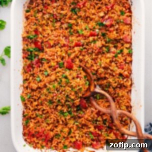 Fluffy Mexican Rice Recipe in a baking pan, garnished with fresh cilantro.