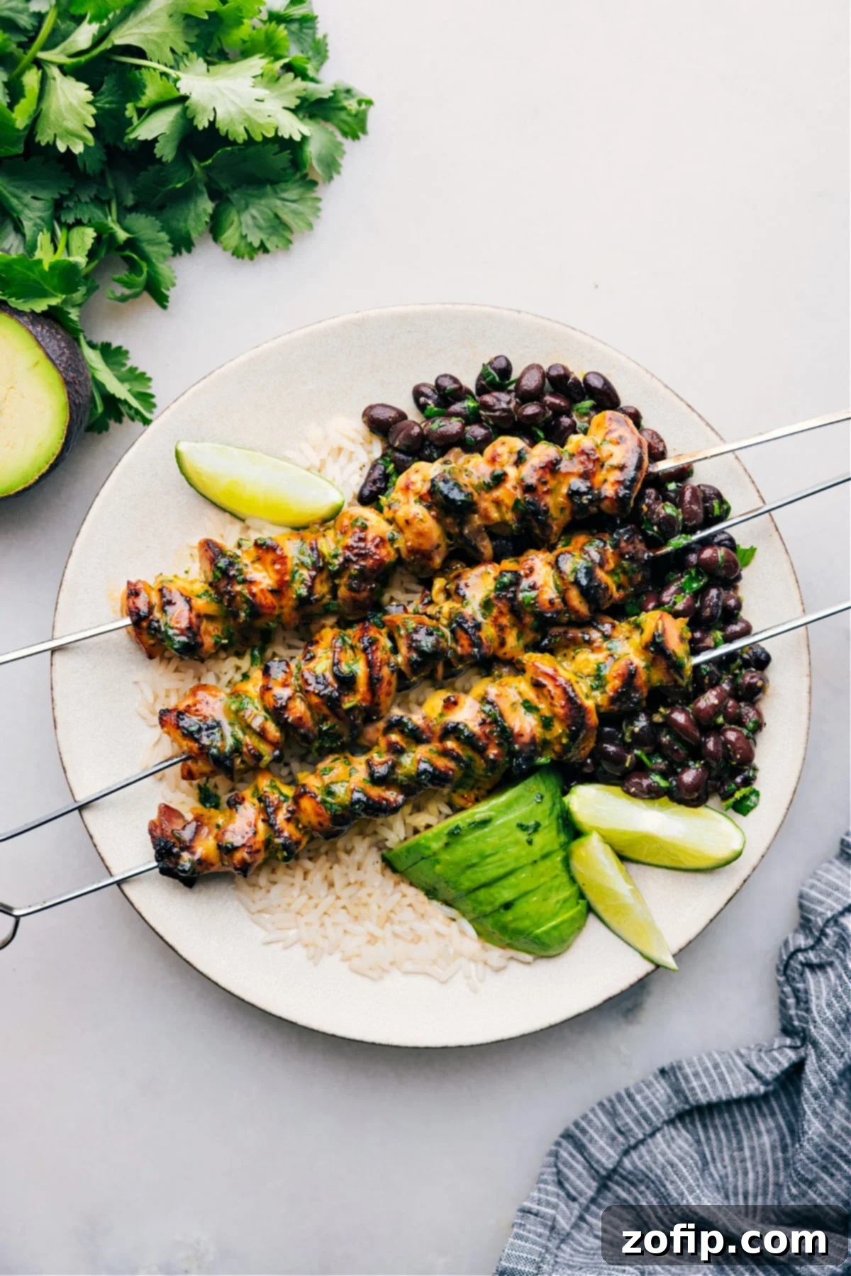 Perfectly marinated and cooked Citrus Chicken served on a bed of fluffy rice, garnished with fresh herbs, showcasing its golden exterior and juicy interior.